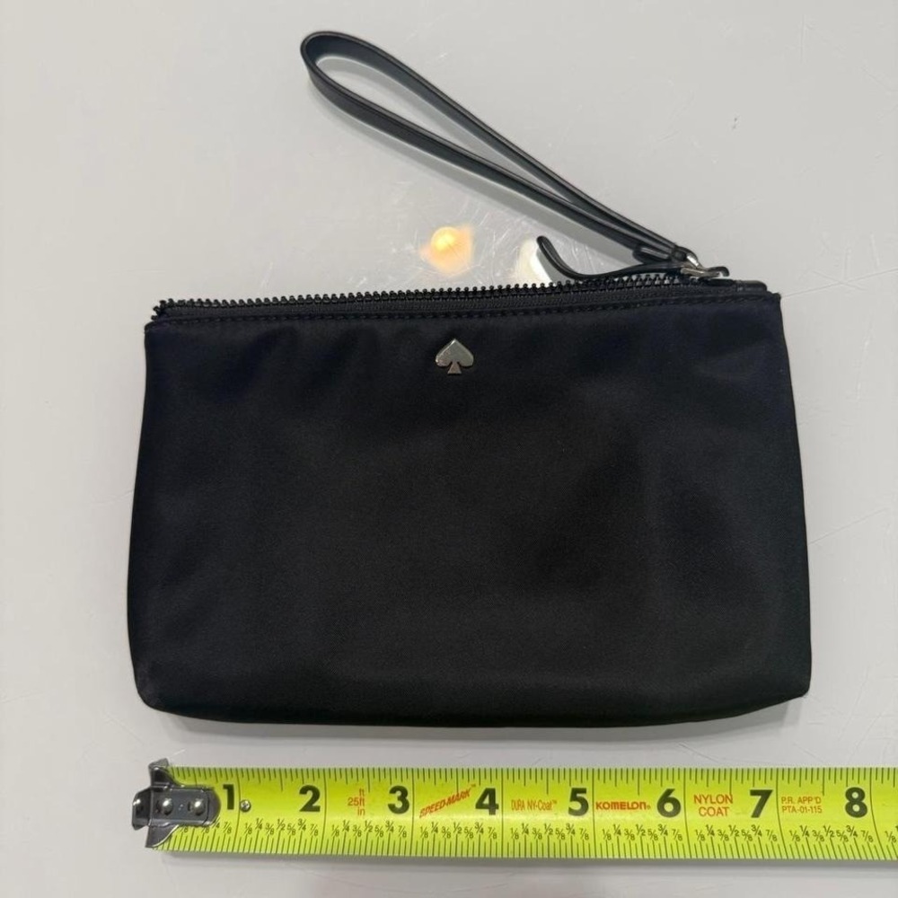 Black Kate Spade vinyl wristlet with gold hardware